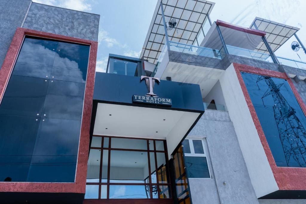 a building with a sign on the front of it at Terraform Hotel in Lagos