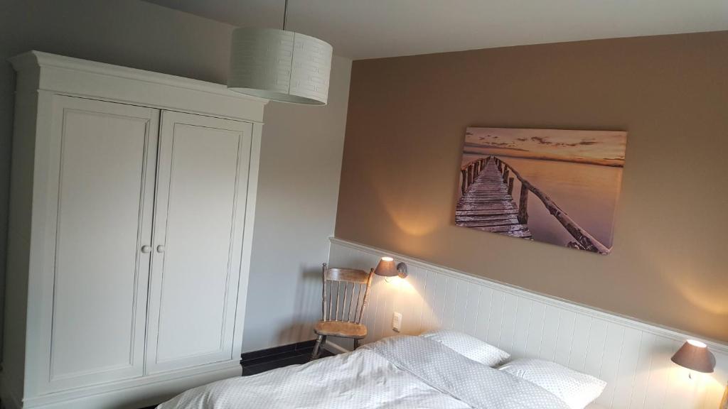 Postel nebo postele na pokoji v ubytování Vakantiewoning onZENhof