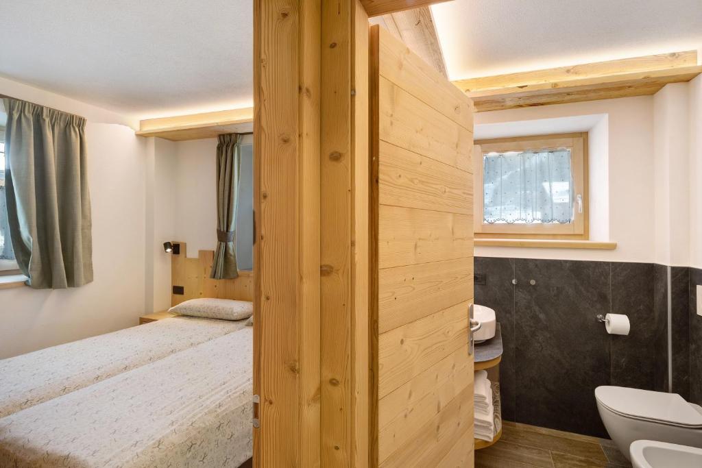 Posteľ alebo postele v izbe v ubytovaní Petalo Rosina's Home