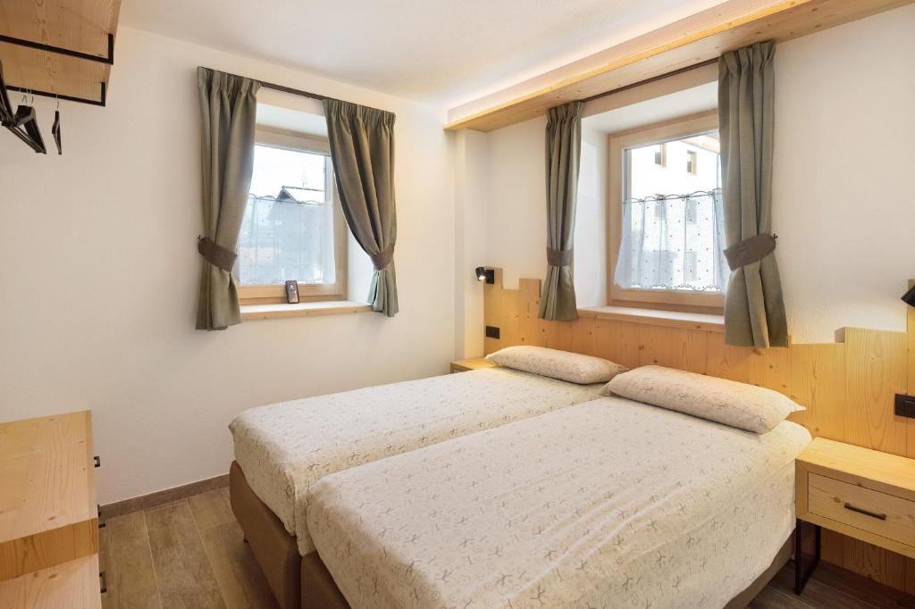 Posteľ alebo postele v izbe v ubytovaní Petalo Rosina's Home