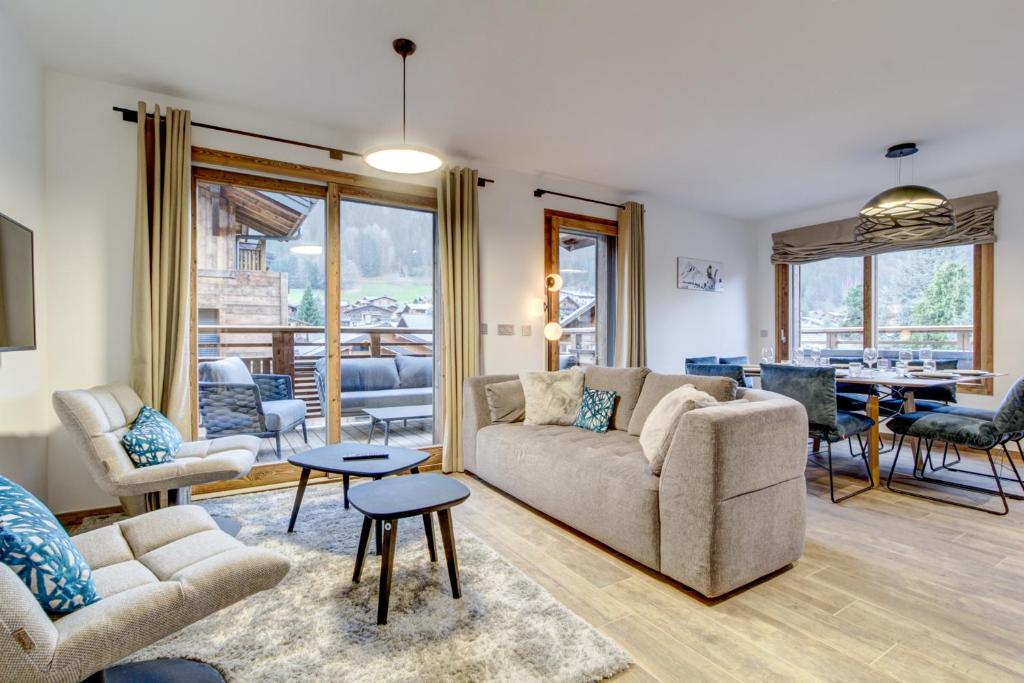a living room with a couch and a table at Echo du Pleney A204 in Morzine