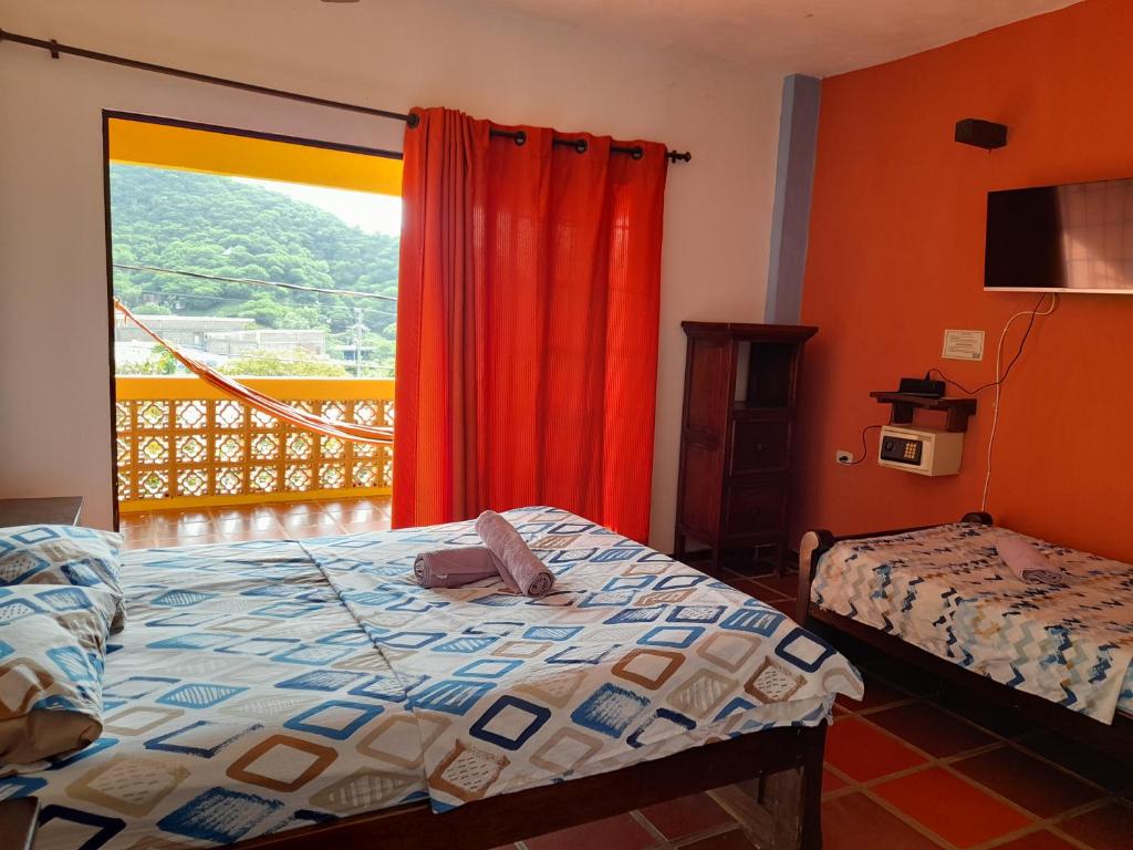 Postelja oz. postelje v sobi nastanitve Hostal La Casa de Felipe