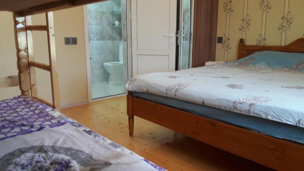 Voodi või voodid majutusasutuse Hasanovs Villa toas