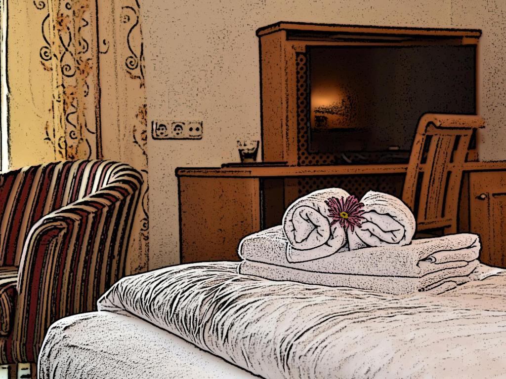 Postel nebo postele na pokoji v ubytování Hotel Crystal - KitzHorn Suites