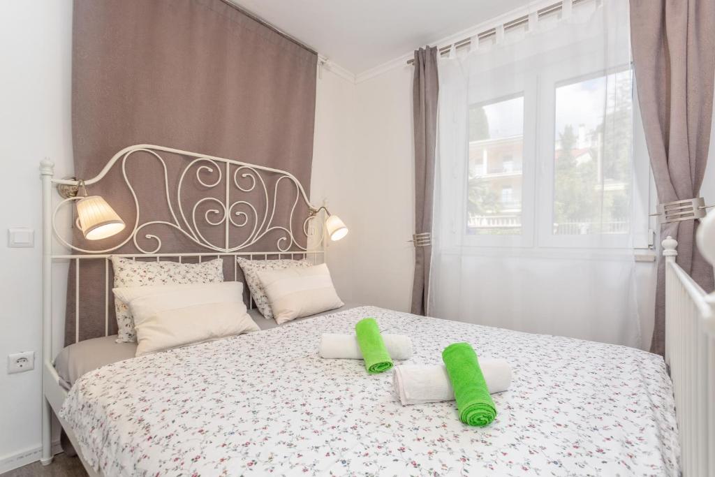 Posteľ alebo postele v izbe v ubytovaní Apartmani Gabi
