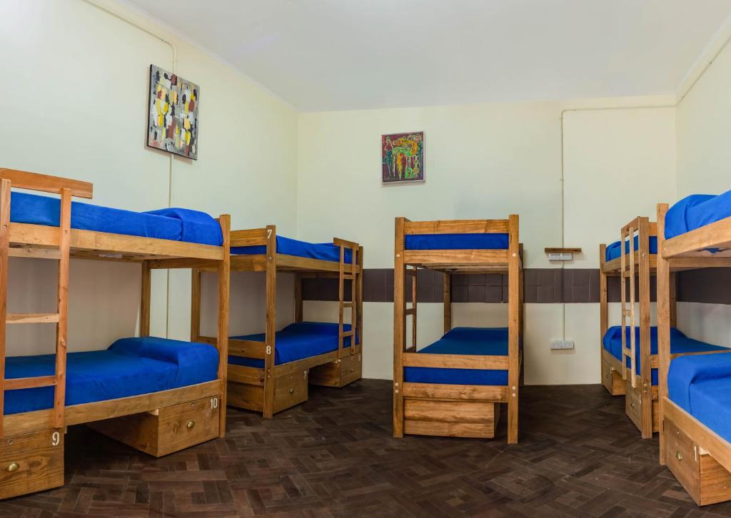 Postel nebo postele na pokoji v ubytování HOSTEL PUNTO RAMIREZ
