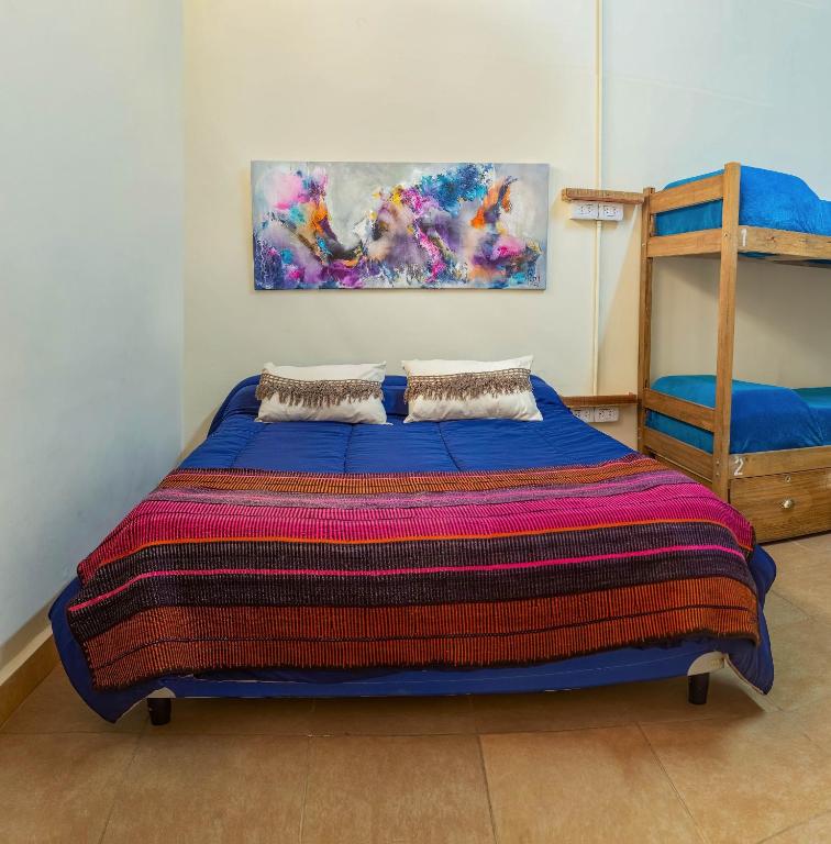Postel nebo postele na pokoji v ubytování HOSTEL PUNTO RAMIREZ