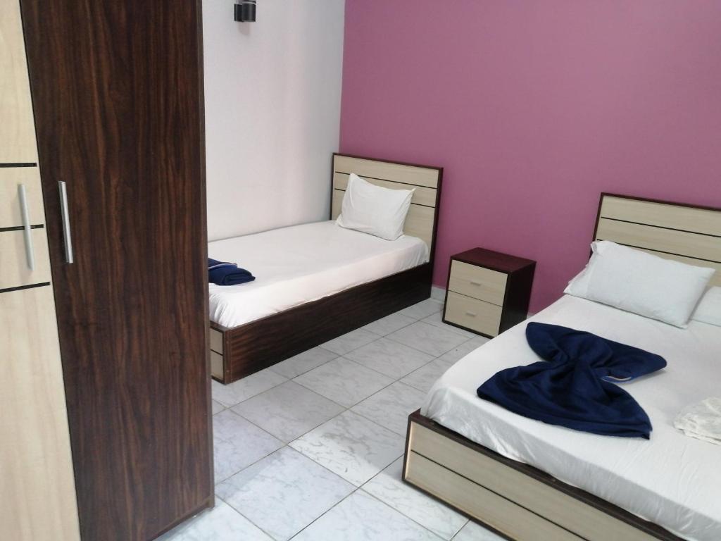 Postel nebo postele na pokoji v ubytování Gardenia Hotel