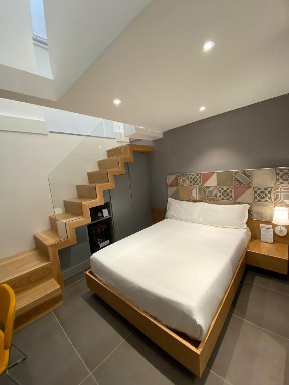 Postel nebo postele na pokoji v ubytování Hotel Medinblu