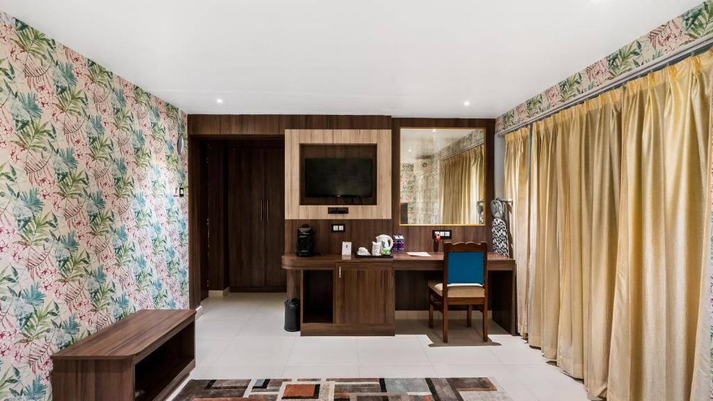 Kuchyň nebo kuchyňský kout v ubytování Niranjana Hotel Bodhgaya