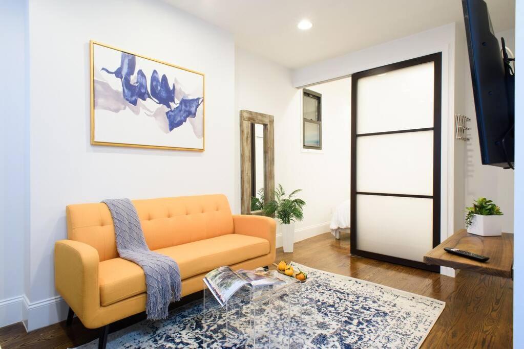 a living room with a couch and a table at 69-2B Prime Lower East East BRAND NEW 1br Apt in New York