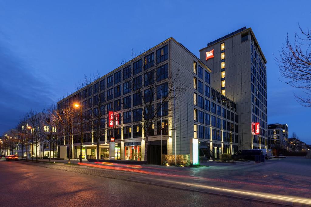 a building on a street at night at ibis München Parkstadt Schwabing in Munich