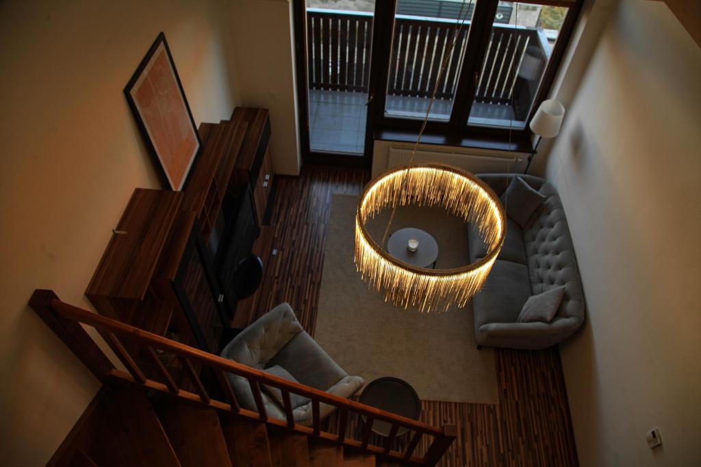 an overhead view of a living room with a couch at Apartment Vila Aston in Veľká Lomnica