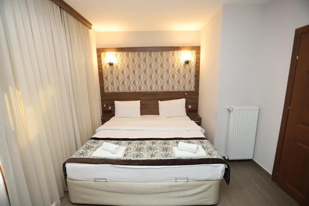 Postel nebo postele na pokoji v ubytování Dolphin Apart Hotel