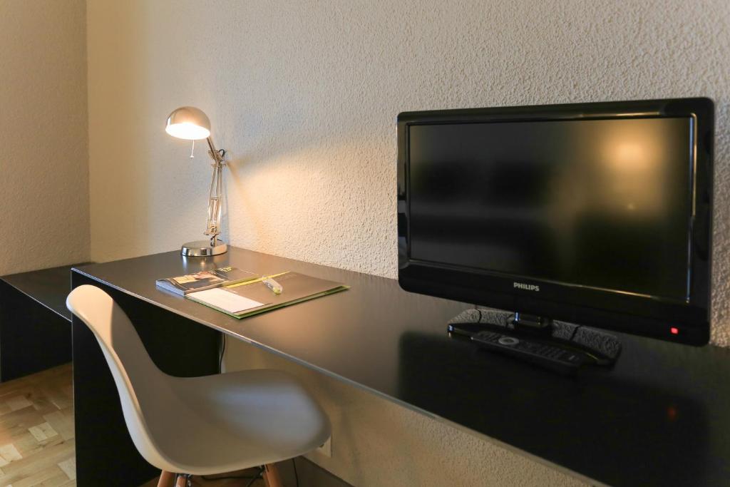 TV a/nebo společenská místnost v ubytování Habitus Hotel Leyre