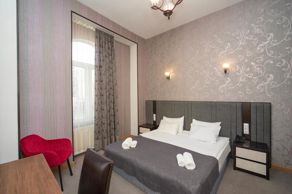 Postel nebo postele na pokoji v ubytování Margi Boutique Hotel by DNT Group