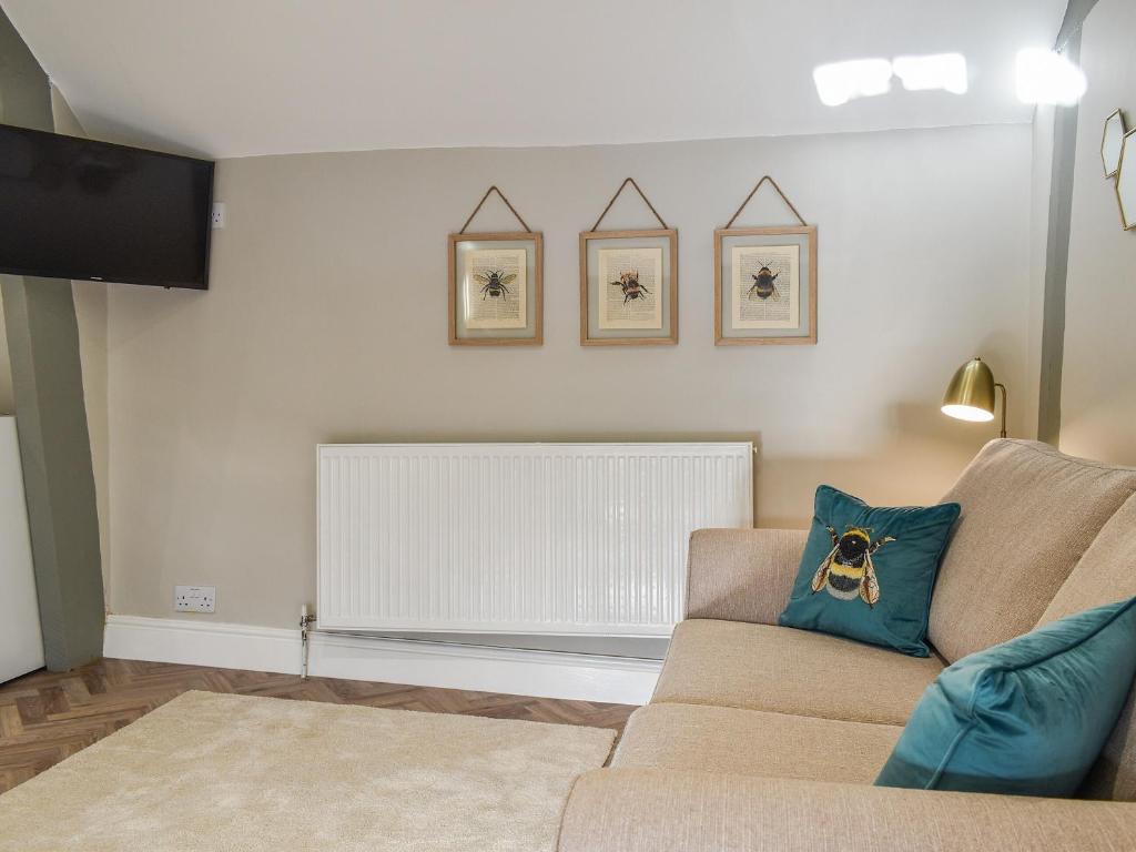 a living room with a couch and a fireplace at Little Hive-uk39430 in Dronfield