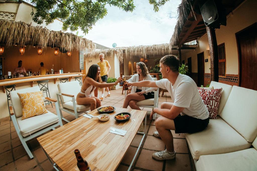 a group of people sitting around a table at Viajero Cartagena Hostel in Cartagena de Indias