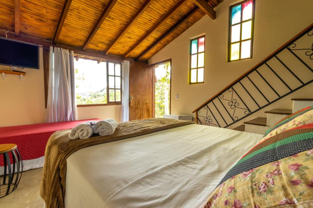 Cama ou camas em um quarto em Casa do Geninho - Suítes