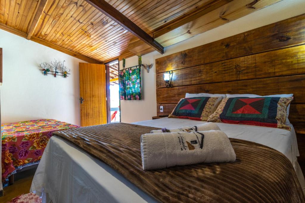 Cama ou camas em um quarto em Casa do Geninho - Suítes
