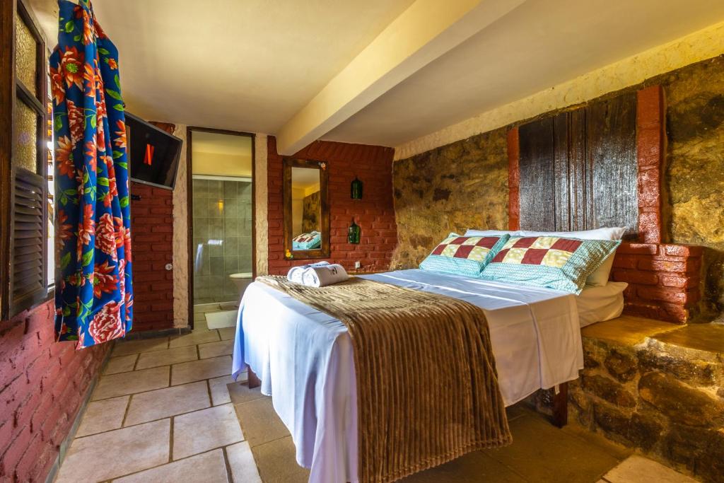 Cama ou camas em um quarto em Casa do Geninho - Suítes