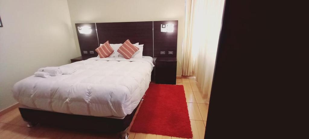 Postel nebo postele na pokoji v ubytování Hotel Mantas Cusco