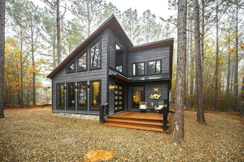 a black modular house in the woods at Moroccan Nights in Broken Bow