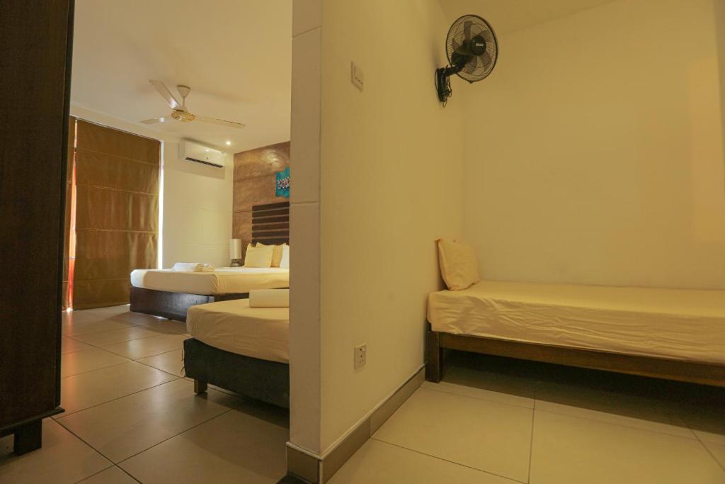 Postel nebo postele na pokoji v ubytování Summerside Residence