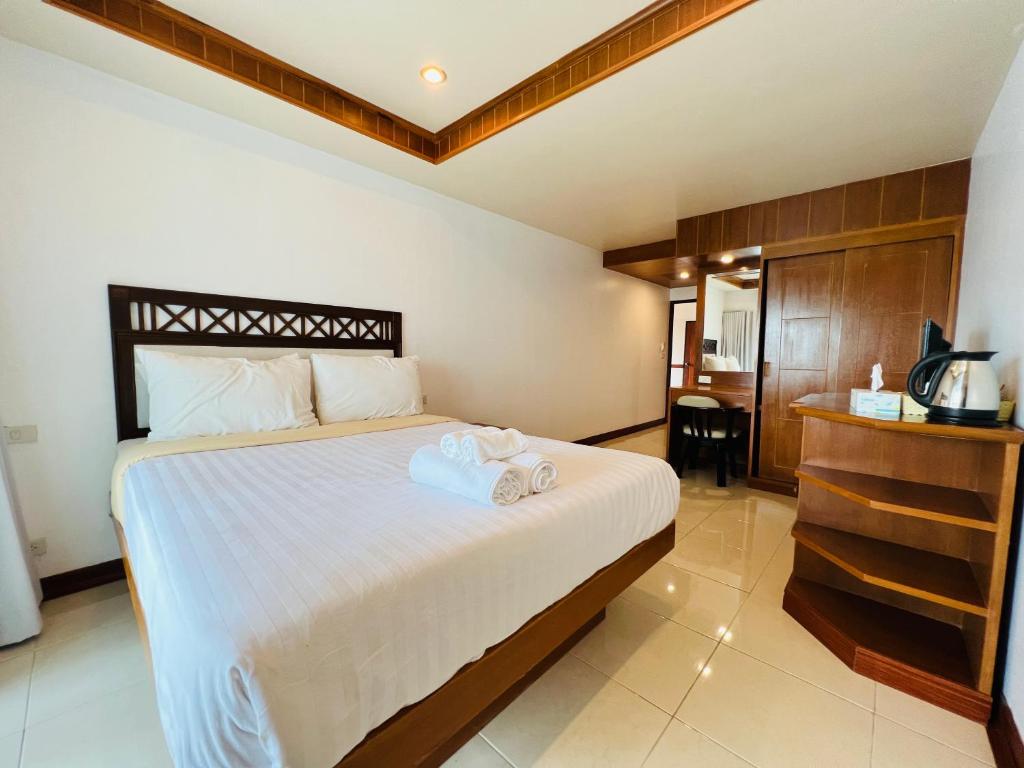 Postel nebo postele na pokoji v ubytování Seaside Palace Hotel