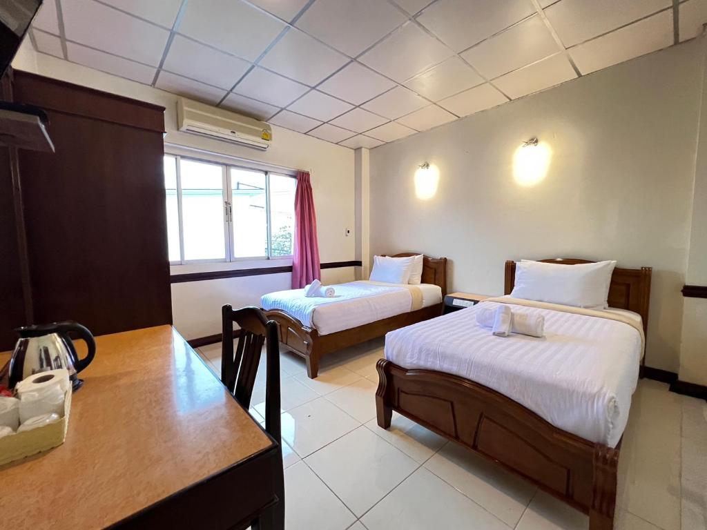 Postel nebo postele na pokoji v ubytování Seaside Palace Hotel