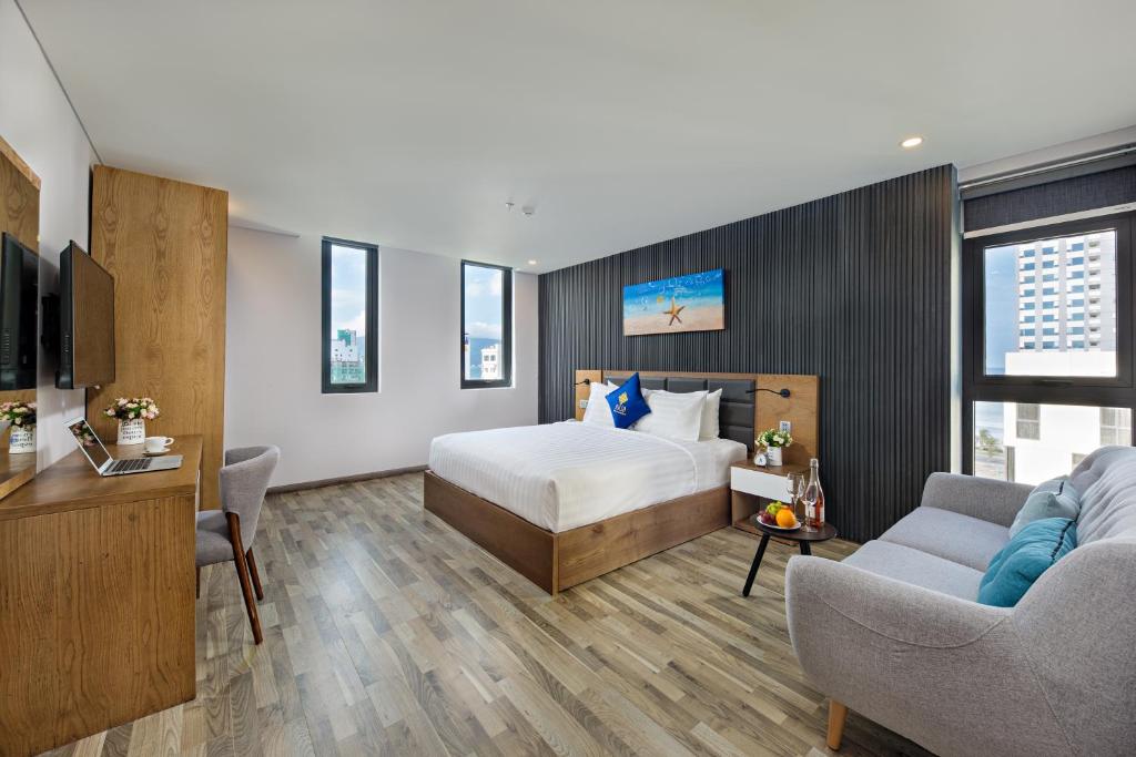 Postel nebo postele na pokoji v ubytování Jolia Hotel Danang Beach