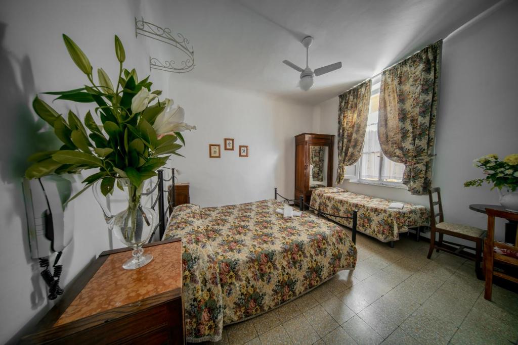 Postel nebo postele na pokoji v ubytování Albergo Tre Donzelle