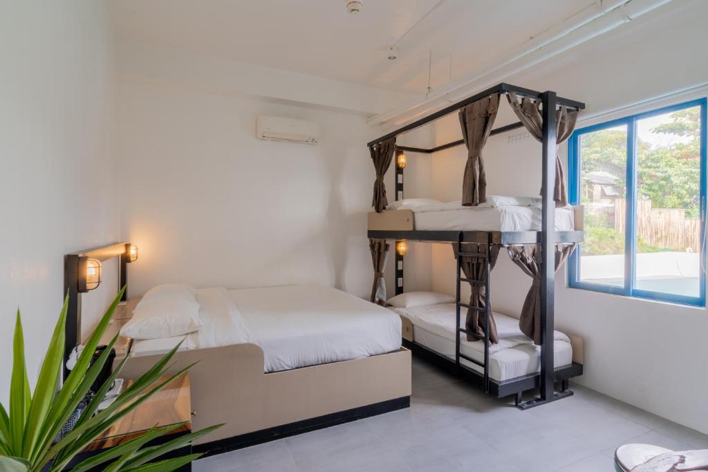 Postel nebo postele na pokoji v ubytování Hop Hostel