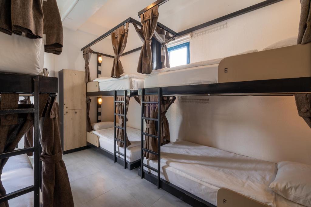 Postel nebo postele na pokoji v ubytování Hop Hostel