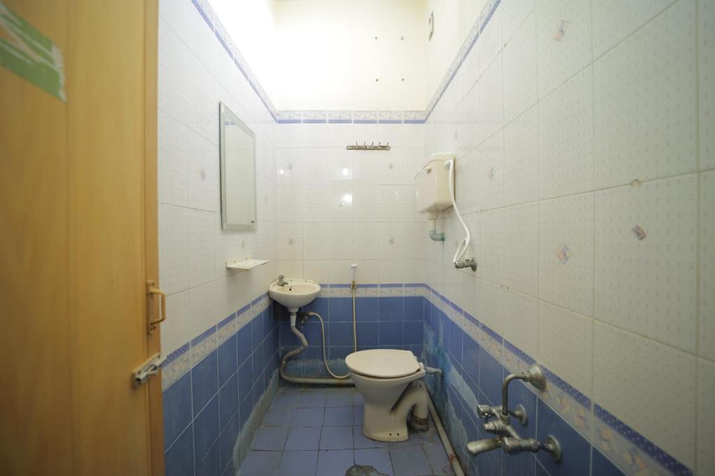 Koupelna v ubytování Karthik residence