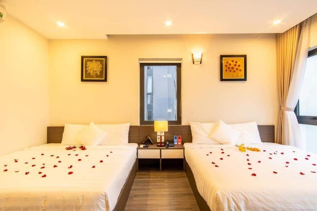Postel nebo postele na pokoji v ubytování The Shann Hotel Danang