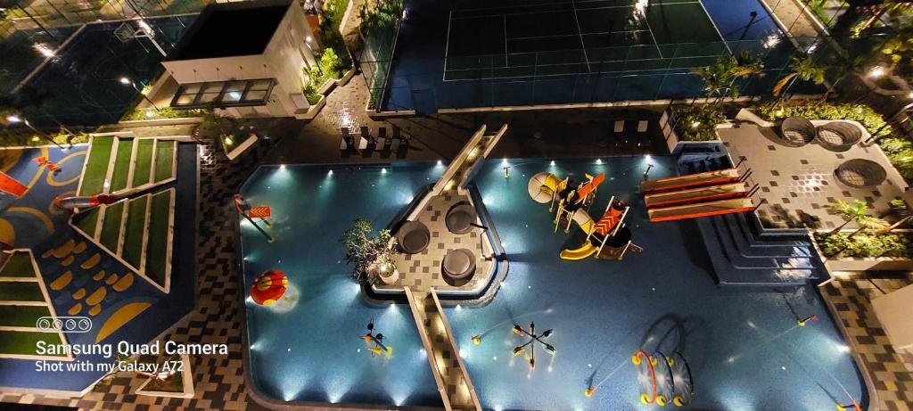 an overhead view of a swimming pool with a pirate ship at Bali Residence Az Zahra Raudhah- Muslim friendly in Melaka