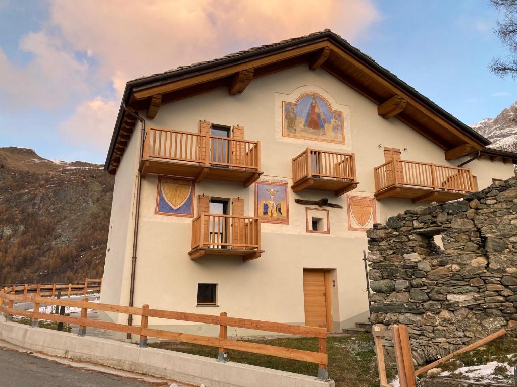 a house with balconies on the side of it at La Maison du Cre in Valtournenche