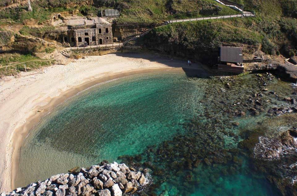 an aerial view of a beach with turquoise water at Casa vacanze Al Civico 72 in Pizzo
