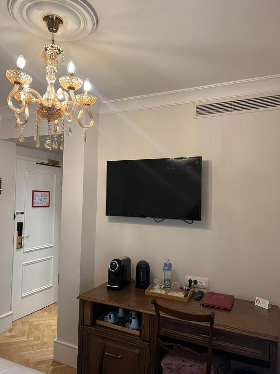 TV a/nebo společenská místnost v ubytování Ebel Boutique Hotel