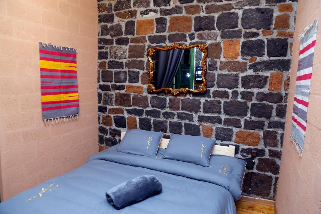 Postel nebo postele na pokoji v ubytování Onoyi Tun Guest House
