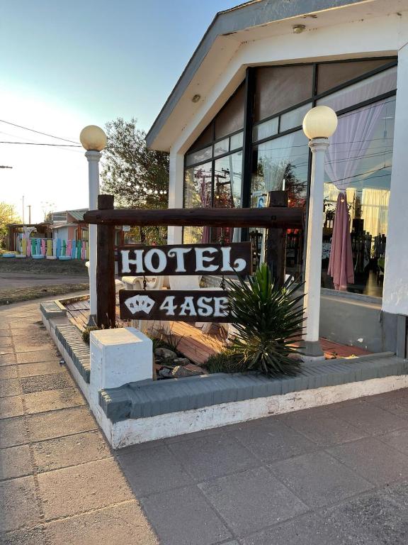 a store with a sign in the window of it at Hotel 4 Ases in Embalse