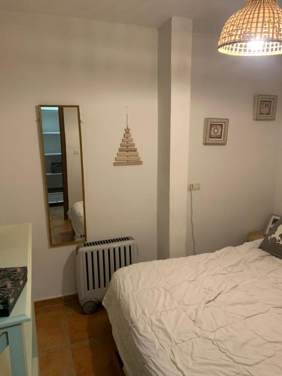 Łóżko lub łóżka w pokoju w obiekcie Apartamento Plaza Pradollano 2