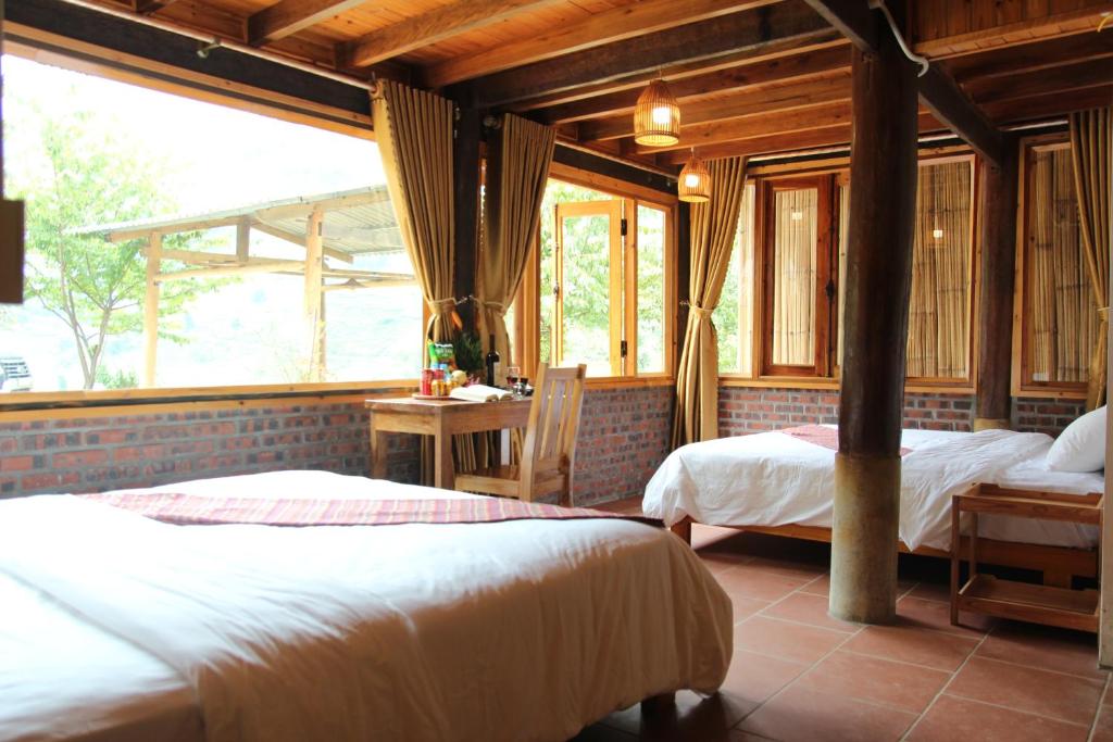 Ein Bett oder Betten in einem Zimmer der Unterkunft Hmong Culture Homestay