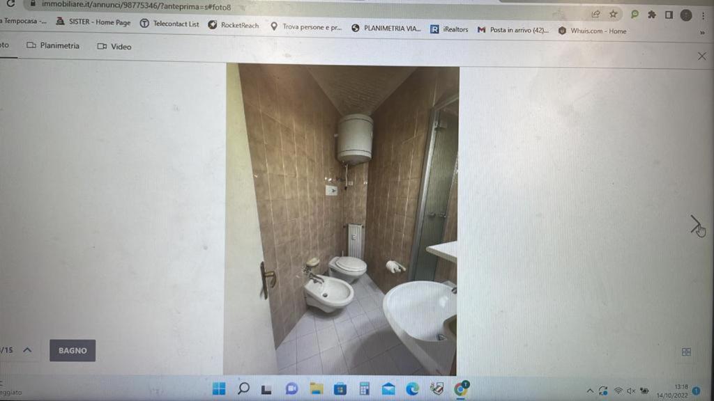 a picture of a bathroom with a toilet and a sink at Monolocale Artesina sci ai piedi in Sella della Turra