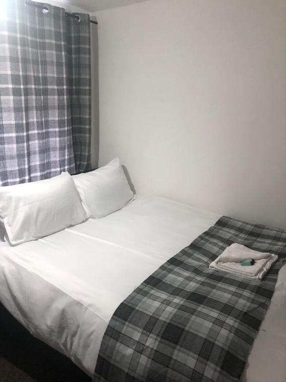 Postel nebo postele na pokoji v ubytování Macpherson House