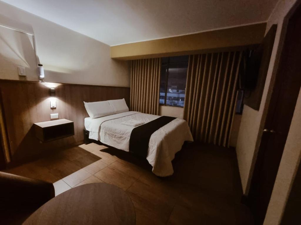 Krevet ili kreveti u jedinici u okviru objekta Hotel Rey