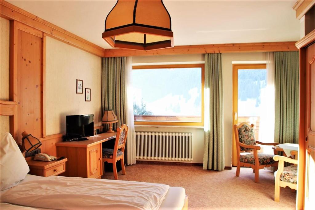 Voodi või voodid majutusasutuse Hotel Alpenrose toas