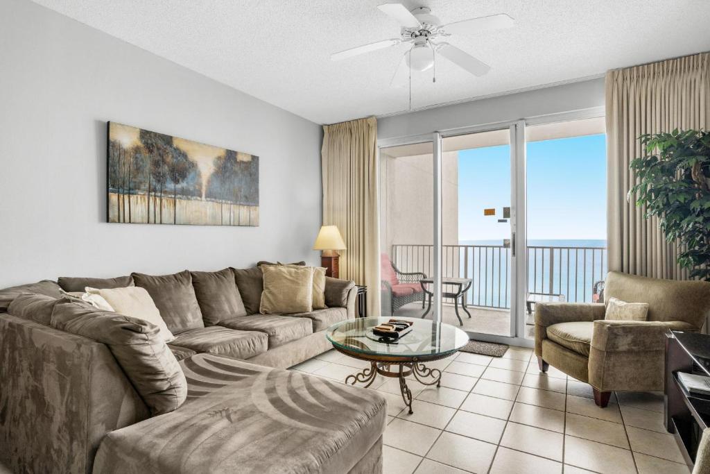 a living room with a couch and a table at Majestic Sun 1012A in Destin