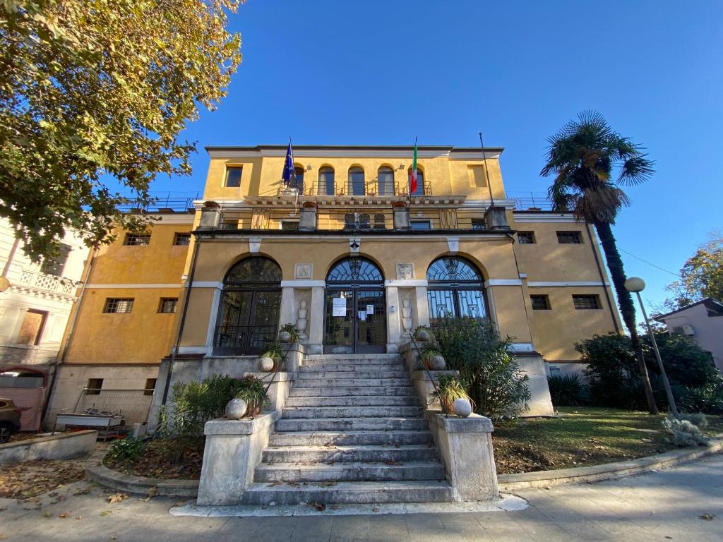 a building with a staircase in front of a building at Ostello di Vicenza in Vicenza